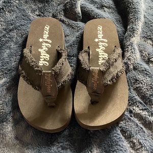 Black sandals with frayed detail